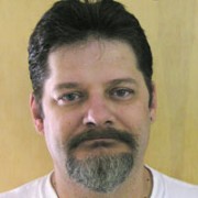 Richard Landrigan Man with short dark hair and mustache and a salt-and-pepper goatee